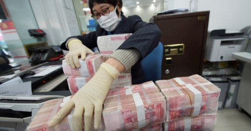Ngân hàng Trung Quốc báo cáo giao dịch tiền mặt từ 14.000USD lên NHTW để ngăn dòng vốn rút mạnh