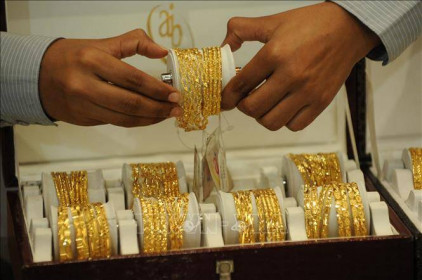 Giá vàng châu Á tăng 1% phiên 27/9 khi đồng USD suy yếu